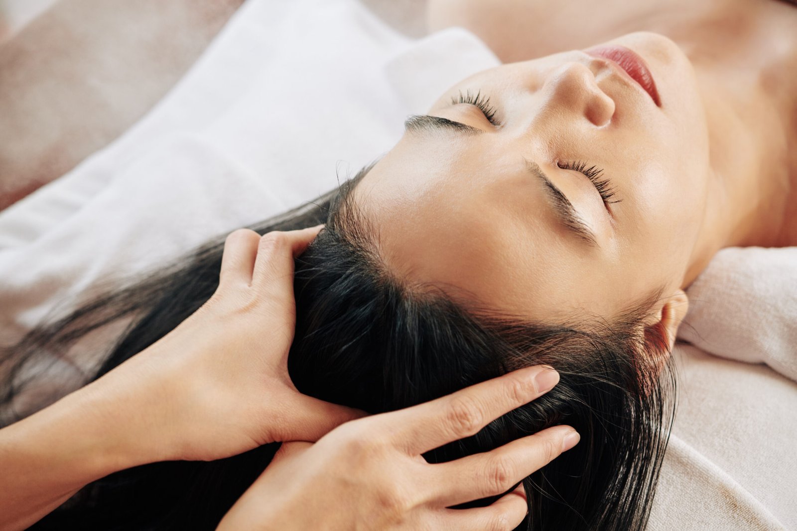 woman relaxing while receiving head massage treatm 2026 01 07 06 59 54 utc scaled